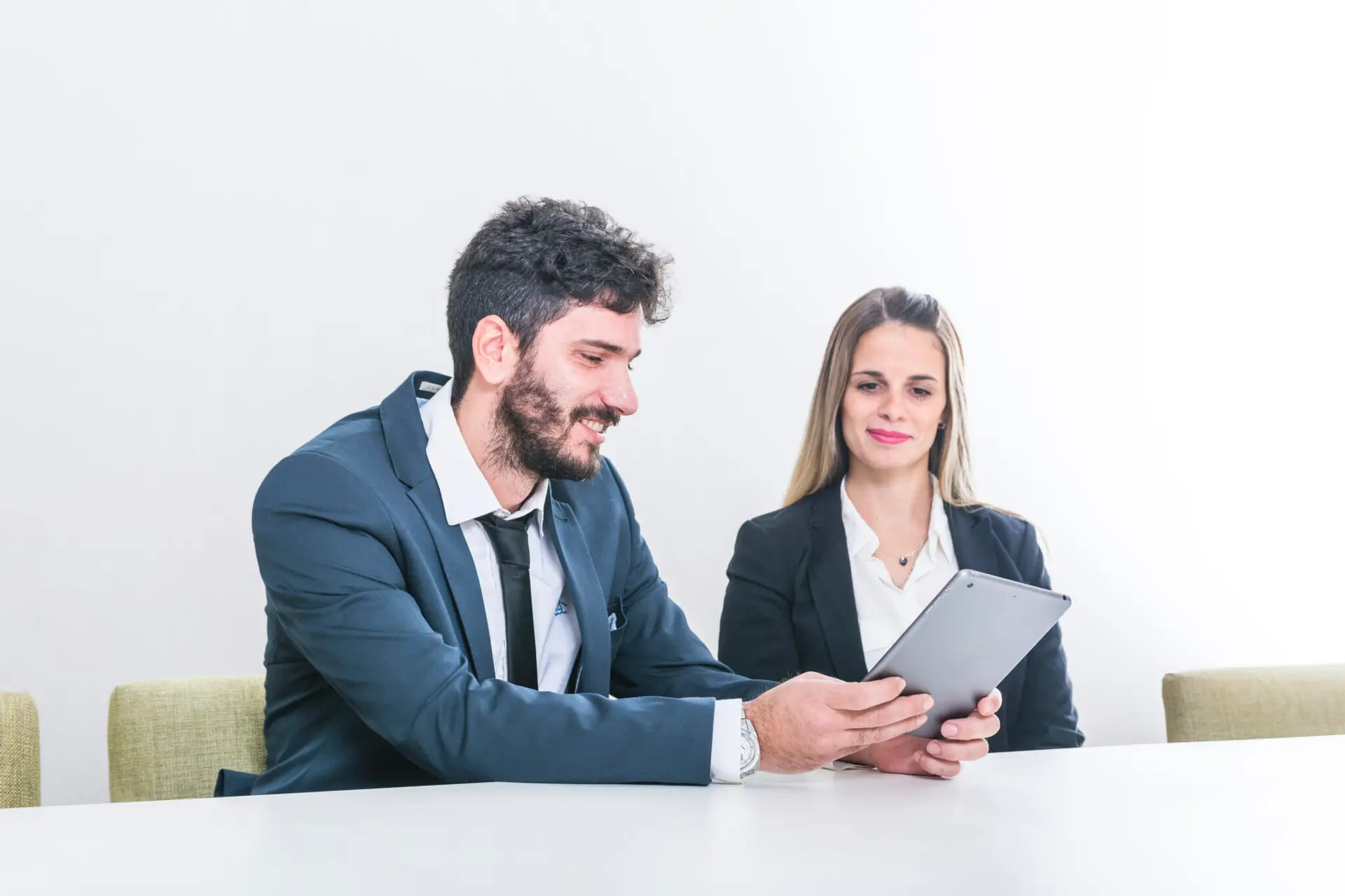 businessman-showing-digital-tablet-her-colleague